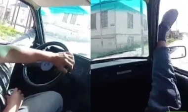 Ayaqlarını pəncərədən çıxaran sürücü və sərnişin həbs edildilər - VİDEO